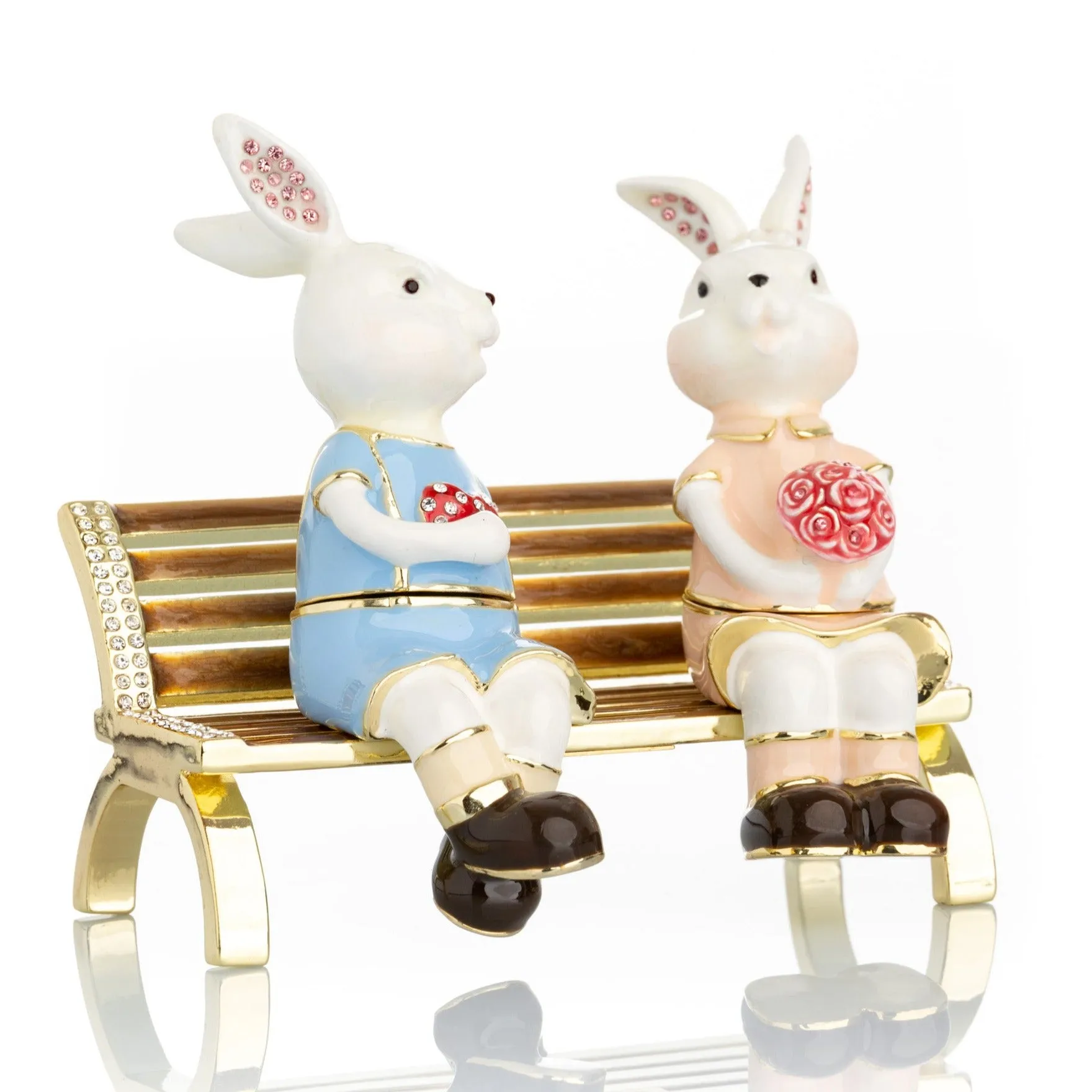 2 bunnies in love sitting on a bench, valentine flowers and chocolates